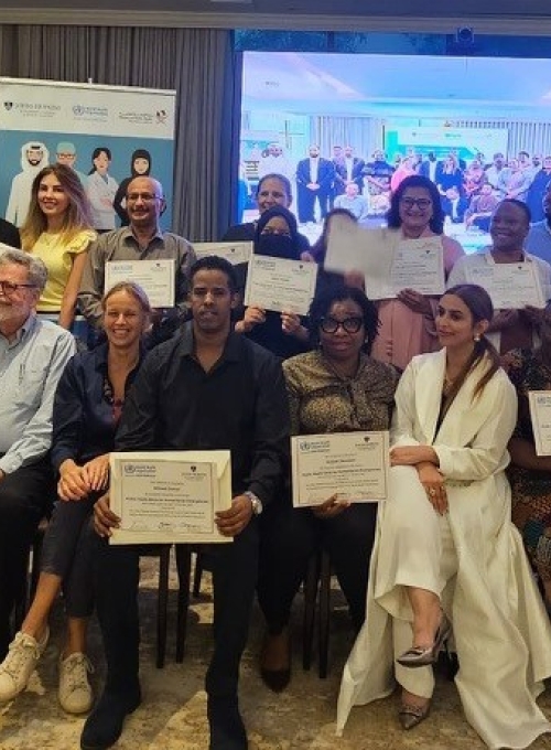 group of people holding certificates