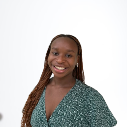 Black woman, smiling in a dress